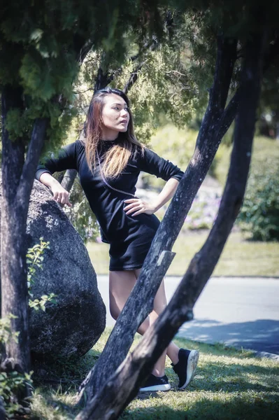 Asia woman posing in park