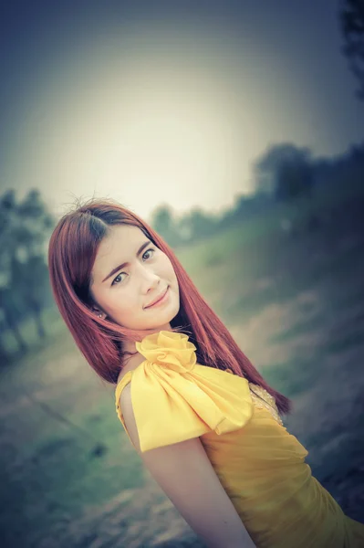 Asia Beautiful woman in yellow dress — Stock Photo, Image