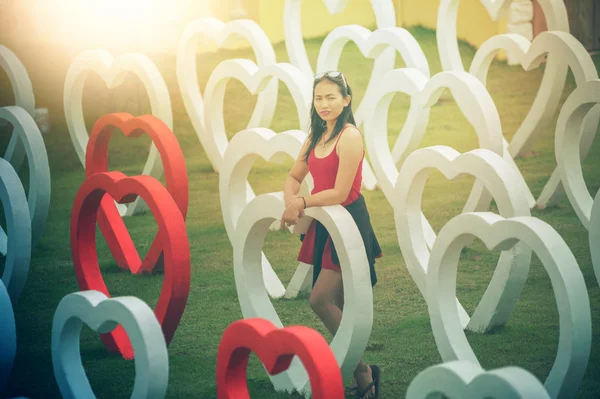 Asia young beautiful woman in heart park — Stock Photo, Image