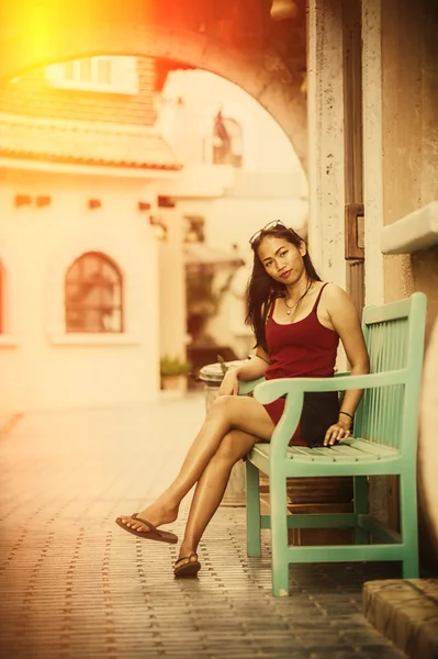 Asia beautiful woman sit relax on green wood chair — Stock Photo, Image
