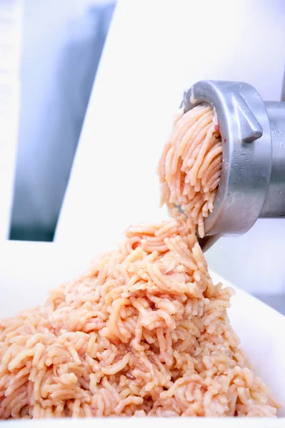 Pork minced meat comes from a mincer — Stock Photo, Image