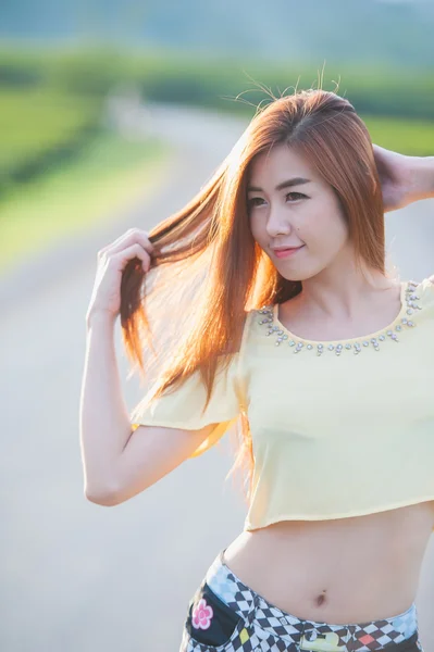 Portrait smile Thai Beautiful girl in sun on the road — Stock Photo, Image