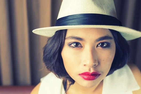head shot of asia woman with hat, beauty concept