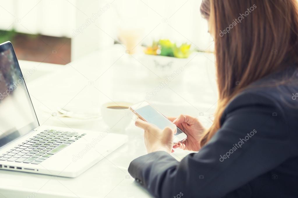 asia business woman texting messages on smartphone in cafe