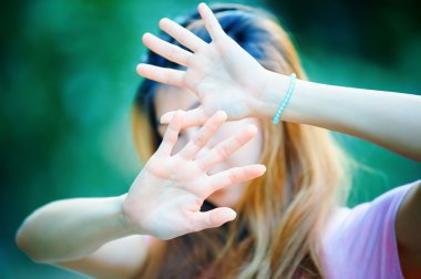 Asian women showing stop hand gesture,  focus hand clipart