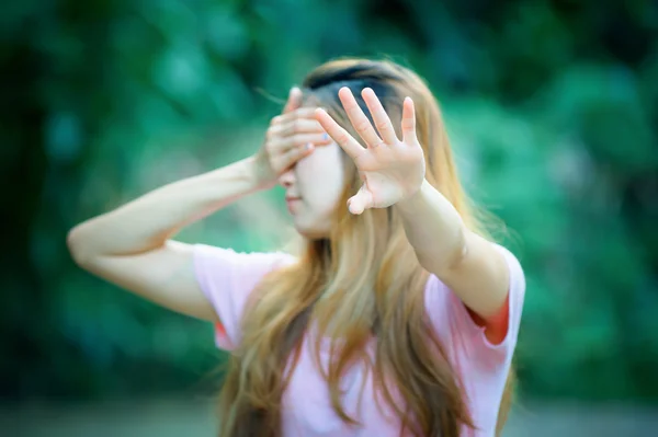 Asia woman covers her face with hand shows stop — Stock Photo, Image