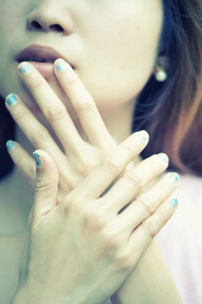 Close-up of beautiful face women and manicured fingers — Stock Photo, Image