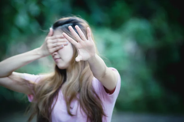 Asia woman covers her face with hand shows stop — Stock Photo, Image