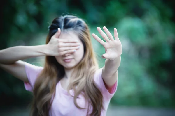 Asia woman covers her face with hand shows stop — Stock Photo, Image