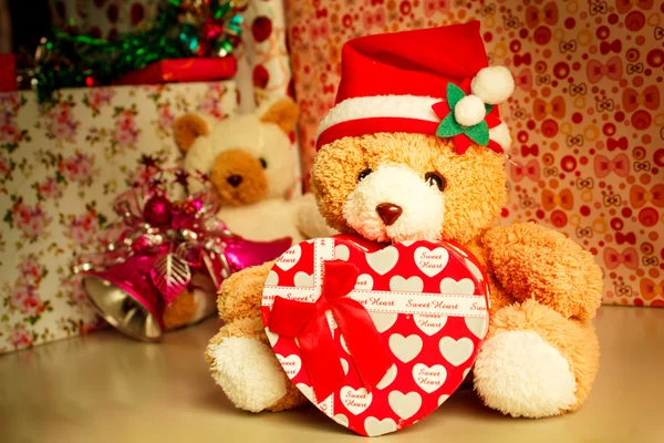 Teddy bear wearing a santa hat.