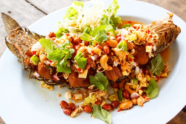 Deep fried fish with herb and spicy sauce. — Stock Photo, Image