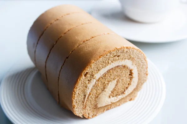 Jam roll, coffee roll cake on plate. — Stock Photo, Image