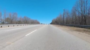 Augusta, Ga USA - 02 21 21: POV FPV driving on an urban highway passing bridge and hotels - Gordon Highway