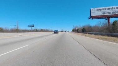Augusta, Ga USA - 02 21 21: POV FPV driving on an urban highway passing closed roads - Gordon Highway