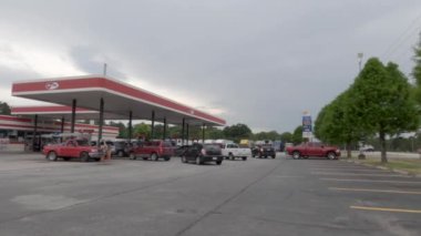 Richmond County, Ga USA - 05 11 21: Pan of Lines at the gas pumps during the gas shortage from the ransomware attack - AM PM Highway 1