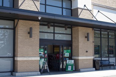 Augusta, Ga USA - 03 04 21: Sprouts grocery retail store entrances and signage 