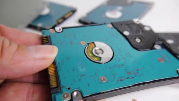 Hand Putting Single Hard Drive Pile Scattered Hard Drives — Stock Video