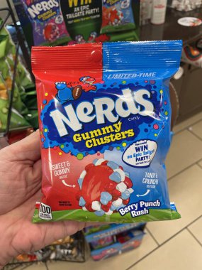 Lakeland, Fla USA - 10 01 24: 7-11 convenience store hand holding Nerds candy