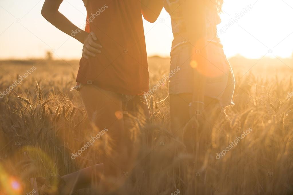 Sexy young girls playing and hugging in the corn fields