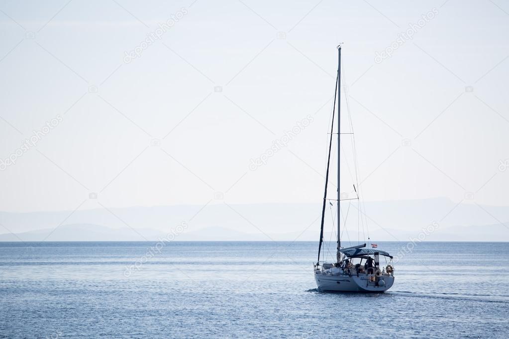 Sailing boat in the adriatic ocean, Croatia. Windless morning.