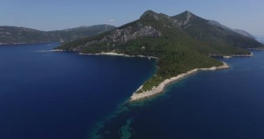 Panoramic view of island. Boat in the bay.