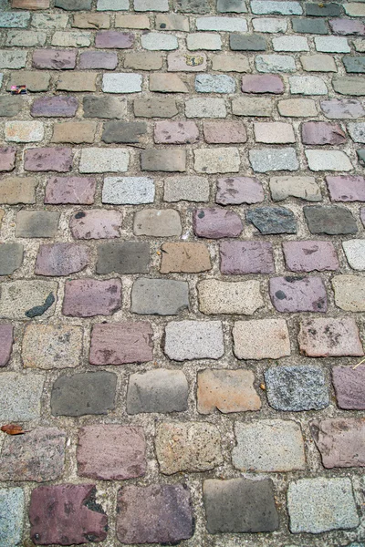 Textur des Straßensteins. Kopfsteinpflaster, — Stockfoto