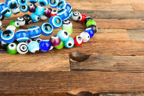 Beads jewelery on wooden background. — Stock Photo, Image