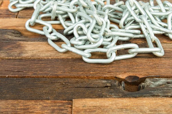 Steel chain on wooden background. — Stock Photo, Image