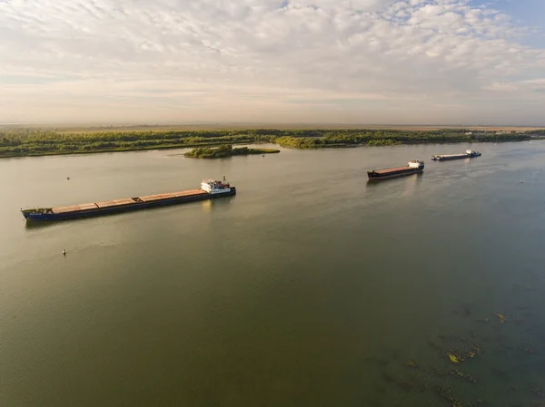 Cargo ship in green river water. — Stock Photo, Image