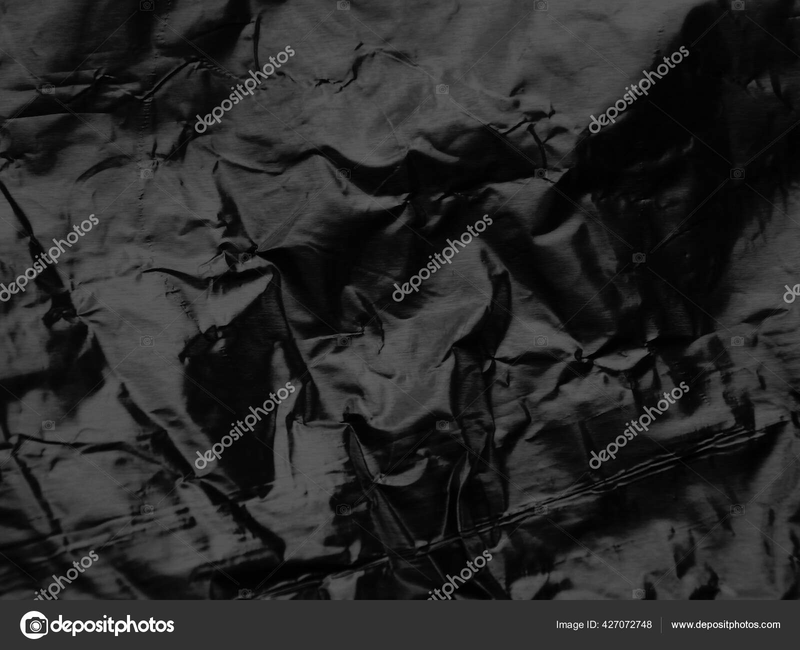 Gefaltete Schwarze Folie Textur Hintergrund - Stockfotografie