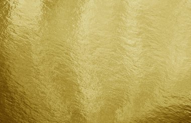 Vurguları ve düzensiz dokusu olan altın folyo arkaplan