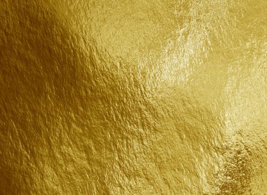 Vurguları ve düzensiz dokusu olan altın folyo arkaplan