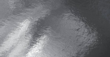 Vurguları ve düz olmayan yüzeyi olan gümüş folyo dokusu