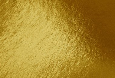 Vurguları ve düzensiz dokusu olan altın folyo arkaplan