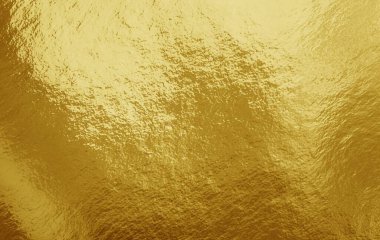 Vurguları ve düzensiz dokusu olan altın folyo arkaplan
