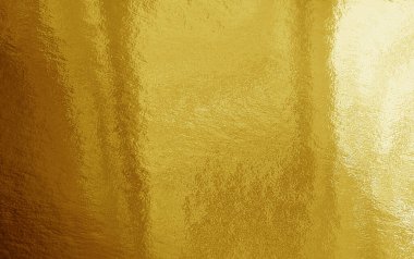 Vurguları ve düzensiz dokusu olan altın folyo arkaplan