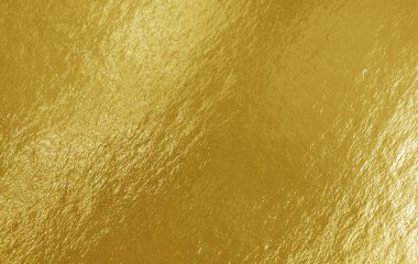 Vurguları ve düz olmayan yüzeyi olan altın folyo dokusu