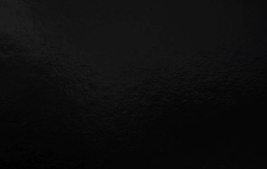 Düz olmayan yüzeyi olan siyah folyo gradyan arkaplan