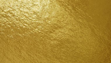 Düz olmayan yüzeyi olan altın folyo dokusu
