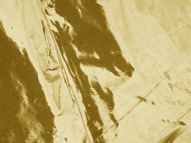 Altın metalik buruşuk folyo dokusu arkaplanı