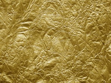 Altın metalik buruşuk folyo dokusu arkaplanı