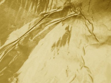 Altın metalik buruşuk folyo dokusu arkaplanı