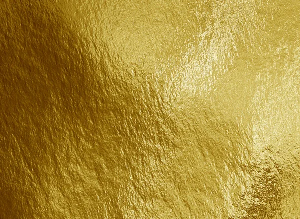 ハイライトと凹凸感のある金箔の背景 — ストック写真