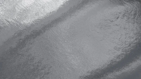 Vurguları ve düz olmayan yüzeyi olan gümüş folyo dokusu