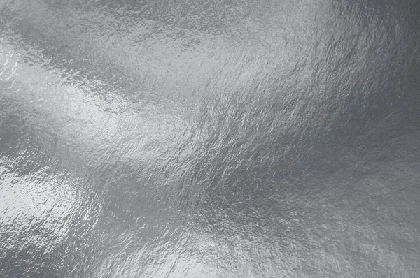 Zilverfolie Textuur Achtergrond Met Hoogtepunten Oneffen Oppervlak — Stockfoto