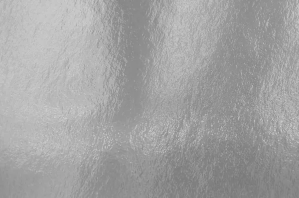 Stříbrná Fólie Textura Pozadí Zvýrazněním Nerovným Povrchem — Stock fotografie