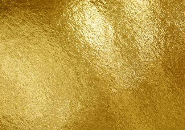 ハイライトと不均一な表面を持つ金箔テクスチャの背景 — ストック写真