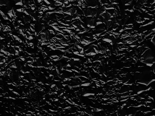 Gerimpelde Zwarte Folie Textuur Achtergrond — Stockfoto