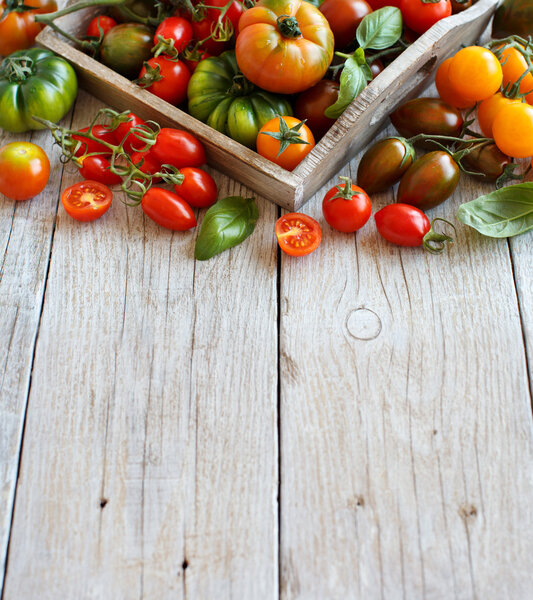 Colorful tomatoes on a wooden table