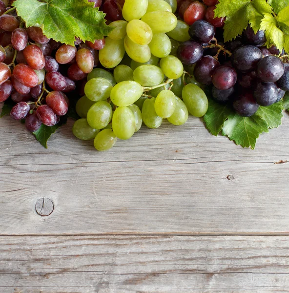 Grapes on a old wooden table